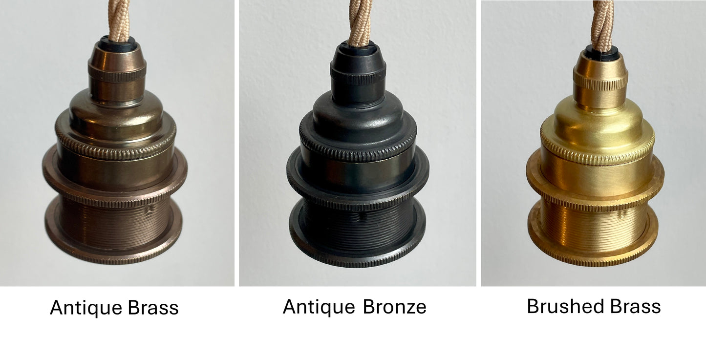 Three lampholders in different finishes: Antique Brass, Antique Bronze, and Brushed Brass.