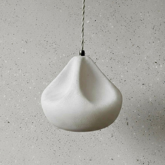 White pendant light on a gray speckled background