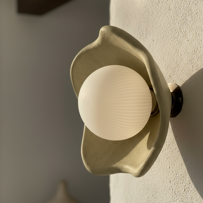 Decorative wall light fixture on a textured wall