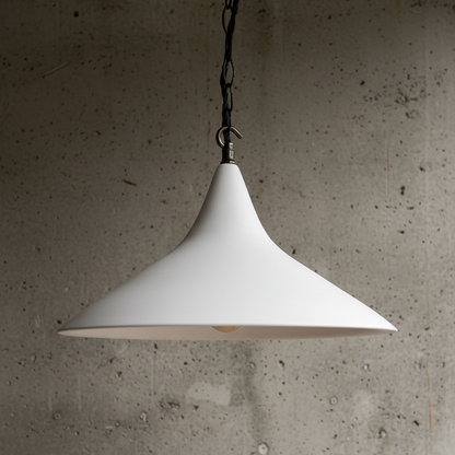 White pendant lamp hanging against a textured concrete wall