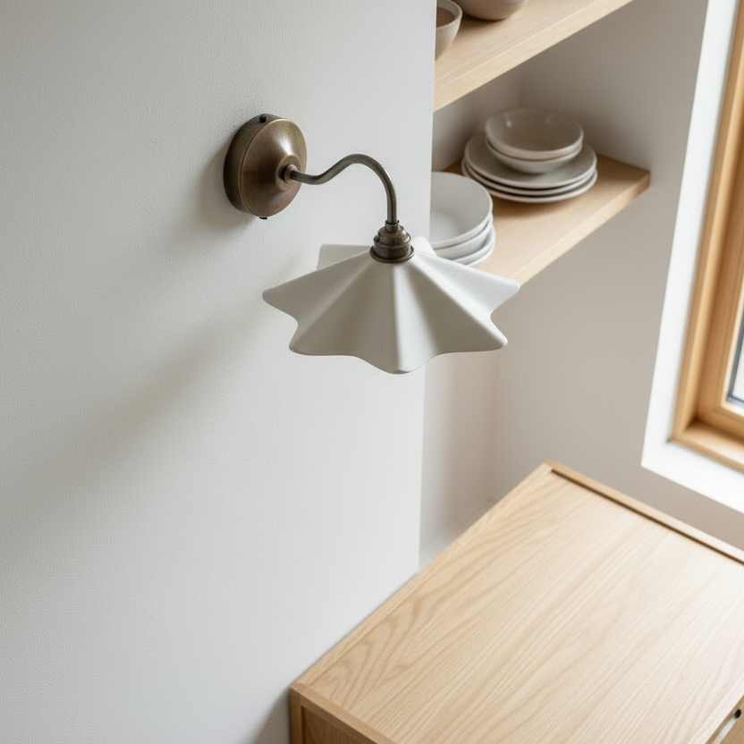 Wall-mounted lamp with a wooden cabinet and shelves in the background
