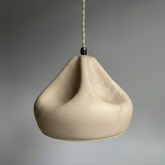 Beige hanging light against a gray background