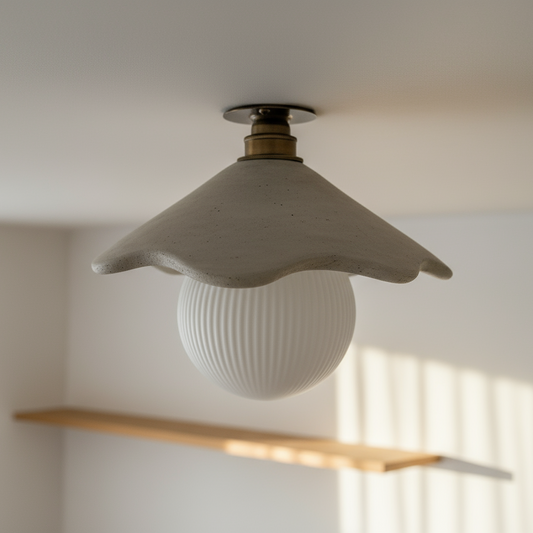 Ceiling light fixture with a textured white bulb in a room with a wooden shelf and window blinds.