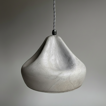 Concrete pendant light on a gray background