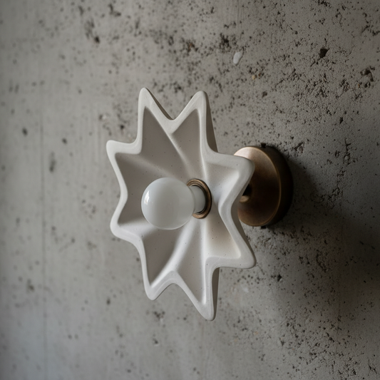 Star-shaped light fixture on a textured wall