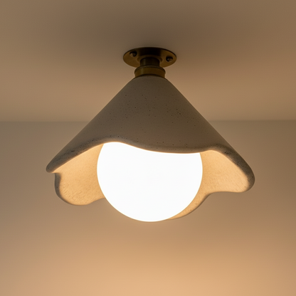 Ceiling light fixture with a white bulb on a plain background
