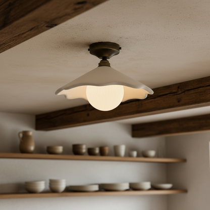 Ceiling light fixture in a room with wooden shelves and ceramic items