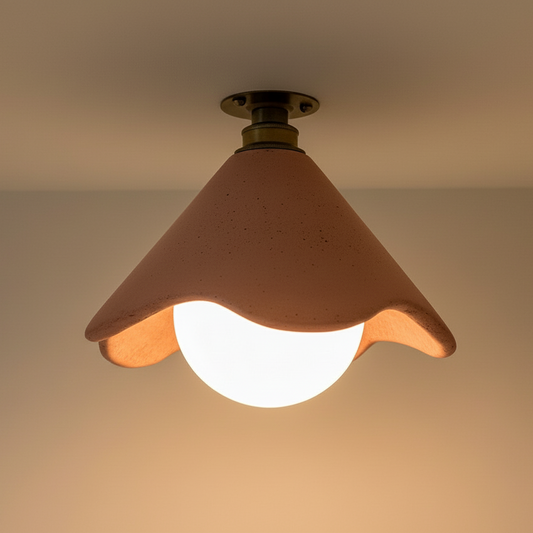 Ceiling light fixture with a terracotta shade on a neutral background