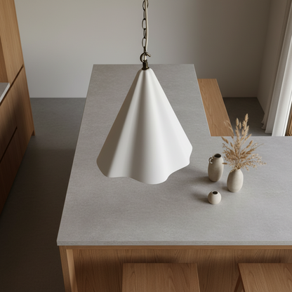 Modern white pendant lamp on a gray table with minimal decor