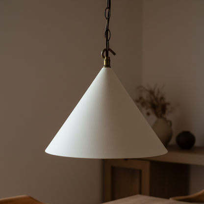 White cone-shaped pendant light hanging against a neutral background