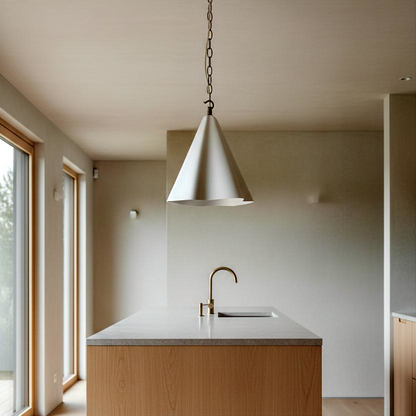 Modern kitchen with pendant light, sink, and wooden cabinets.