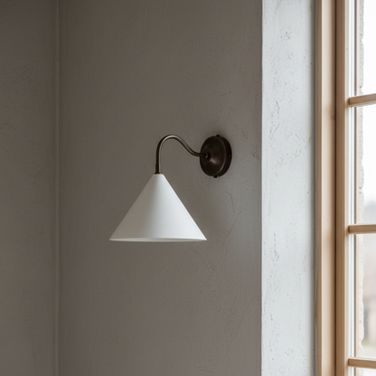 Wall-mounted lamp with white shade and black fixture on a gray wall.