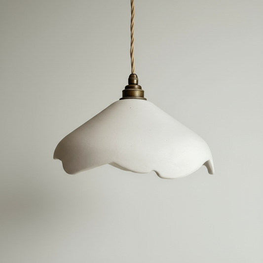 White pendant lamp with a textured shade on a plain background