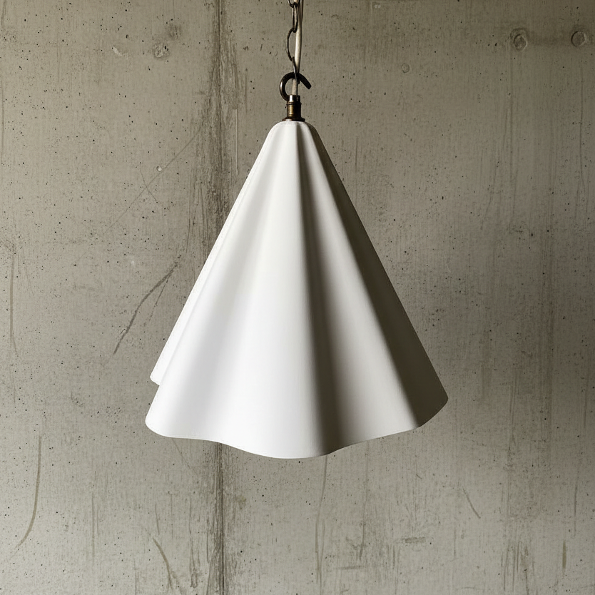 White cone-shaped pendant light against a textured concrete wall